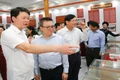 Đồng chí Lê Quốc Minh, Ủy viên Trung ương Đảng, Tổng Biên tập Báo Nhân Dân, Phó Trưởng Ban Tuyên giáo và Dân vận Trung ương, Chủ tịch Hội Nhà báo Việt Nam và các nhà báo thăm Di tích Trường dạy làm báo Huỳnh Thúc Kháng.
